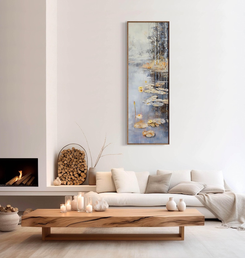 This serene painting features a tranquil pond with lily pads and birch trees. The soft, muted colors and delicate details create a peaceful, reflective scene, perfect for adding a touch of nature and calm to any space.