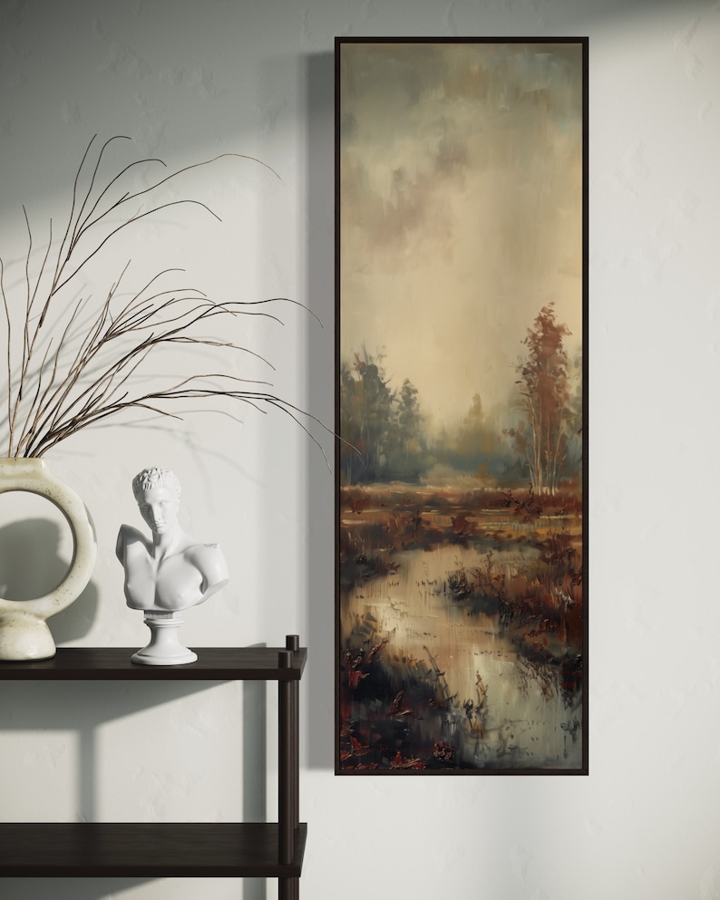 This atmospheric painting captures a moody landscape with a dramatic interplay of light and shadow. A muted palette conveys the serenity of a misty marshland, evoking a sense of quiet introspection.