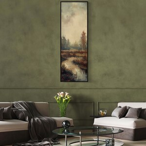 This atmospheric painting captures a moody landscape with a dramatic interplay of light and shadow. A muted palette conveys the serenity of a misty marshland, evoking a sense of quiet introspection.