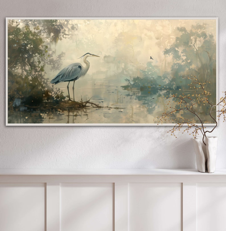 A serene heron stands amidst a tranquil swamp, reflected in the calm waters, set against a backdrop of ethereal, golden-hued trees and a soft, diffuse light that permeates this peaceful landscape painting.