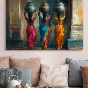 Celebrate cultural beauty with this vibrant art piece depicting three Indian women in colorful saris, gracefully carrying pots on their heads. The rich textures and warm tones make it a stunning addition to any space.