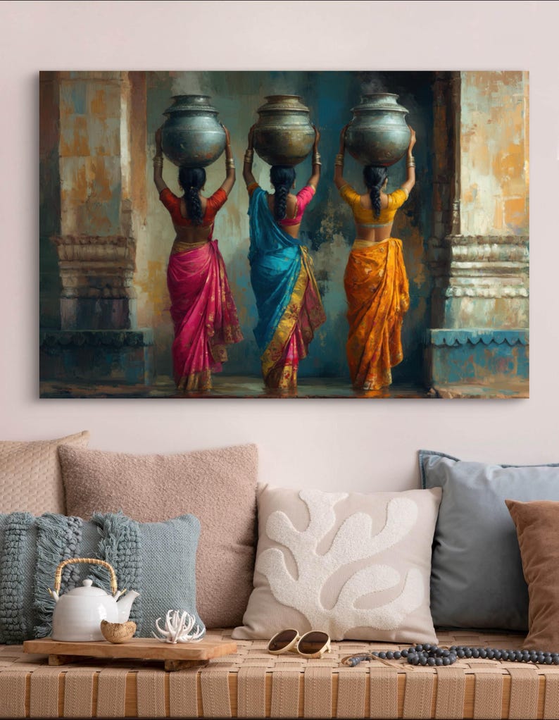 Celebrate cultural beauty with this vibrant art piece depicting three Indian women in colorful saris, gracefully carrying pots on their heads. The rich textures and warm tones make it a stunning addition to any space.
