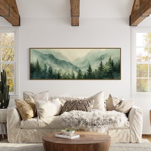 Misty Mountain Serenity: A dreamy vista where lush evergreens pierce through the soft veil of morning mist, creating layers of tranquil beauty.