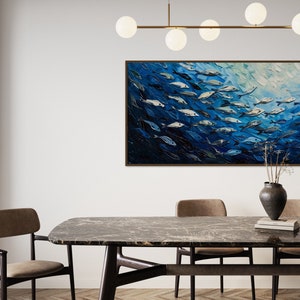 A dynamic school of fish swims in unison through the tranquil blue sea, their silvery scales reflecting light, depicted with thick, textured brushstrokes that give life and movement to this captivating marine scene.