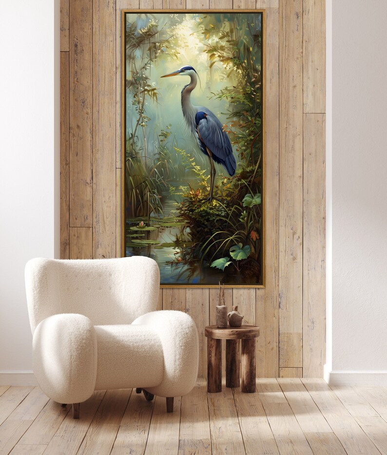A serene Blue Heron stands amidst a lush wetland oasis, its graceful form bathed in dappled sunlight filtering through a verdant canopy. Perfect for a tranquil decor piece.