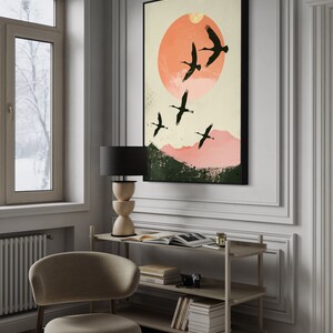 Silhouettes in Flight: A serene composition featuring cranes soaring across a textured pink sunset, their graceful forms framed against a full moon.
