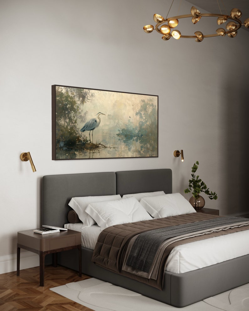 A serene heron stands amidst a tranquil swamp, reflected in the calm waters, set against a backdrop of ethereal, golden-hued trees and a soft, diffuse light that permeates this peaceful landscape painting.