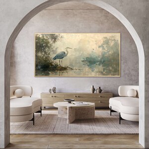 A serene heron stands amidst a tranquil swamp, reflected in the calm waters, set against a backdrop of ethereal, golden-hued trees and a soft, diffuse light that permeates this peaceful landscape painting.