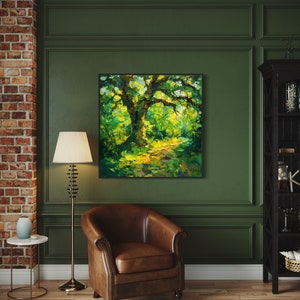 The old oak stands regal and enduring, its twisting branches like wise, outstretched arms, cloaked in a tapestry of sun-kissed leaves, creating a serene sanctuary of nature's timeless beauty.