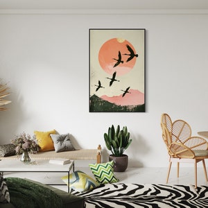 Silhouettes in Flight: A serene composition featuring cranes soaring across a textured pink sunset, their graceful forms framed against a full moon.