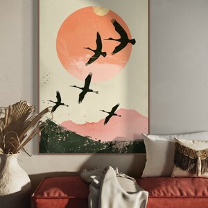 Silhouettes in Flight: A serene composition featuring cranes soaring across a textured pink sunset, their graceful forms framed against a full moon.