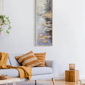 This serene painting features a tranquil pond with lily pads and birch trees. The soft, muted colors and delicate details create a peaceful, reflective scene, perfect for adding a touch of nature and calm to any space.