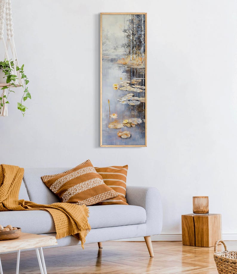 This serene painting features a tranquil pond with lily pads and birch trees. The soft, muted colors and delicate details create a peaceful, reflective scene, perfect for adding a touch of nature and calm to any space.