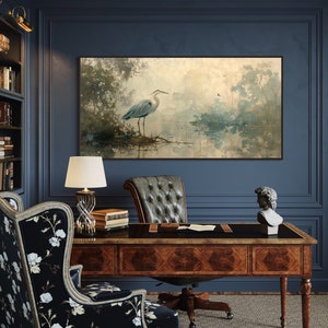 A serene heron stands amidst a tranquil swamp, reflected in the calm waters, set against a backdrop of ethereal, golden-hued trees and a soft, diffuse light that permeates this peaceful landscape painting.