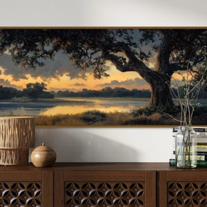 Capturing the tranquil essence of dusk, this panoramic artwork features a majestic oak tree overlooking a serene river, illuminated by the golden hues of a setting sun.