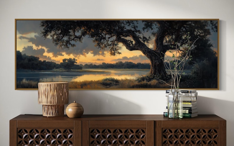 Capturing the tranquil essence of dusk, this panoramic artwork features a majestic oak tree overlooking a serene river, illuminated by the golden hues of a setting sun.