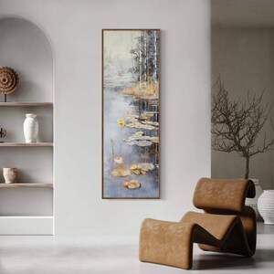 This serene painting features a tranquil pond with lily pads and birch trees. The soft, muted colors and delicate details create a peaceful, reflective scene, perfect for adding a touch of nature and calm to any space.