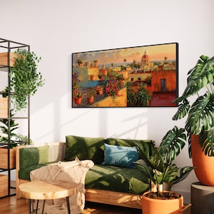This colorful painting shows a Mexican city at sunset with terracotta rooftops, blooming bougainvillea, and church domes. The warm hues and intricate details evoke the charm and beauty of a picturesque Mexican town, perfect for cultural decor.