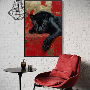 Striking art print of a black panther resting against a rich red and gold abstract background. The panther’s piercing gaze, sleek dark fur, and powerful presence create a dramatic and luxurious statement piece, blending wildlife majesty with bold modern art design for a captivating interior accent.
