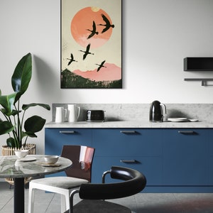 Silhouettes in Flight: A serene composition featuring cranes soaring across a textured pink sunset, their graceful forms framed against a full moon.