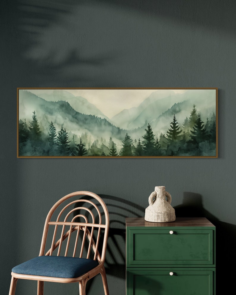 Misty Mountain Serenity: A dreamy vista where lush evergreens pierce through the soft veil of morning mist, creating layers of tranquil beauty.
