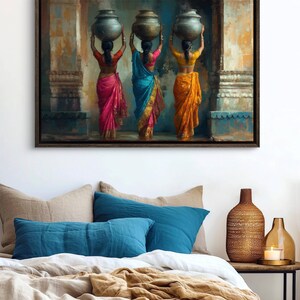 Celebrate cultural beauty with this vibrant art piece depicting three Indian women in colorful saris, gracefully carrying pots on their heads. The rich textures and warm tones make it a stunning addition to any space.