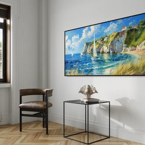 Sailboats glide on azure waters near chalky cliffs with green tops under a vast, cloud-dappled sky, portraying a serene, sunlit seascape.