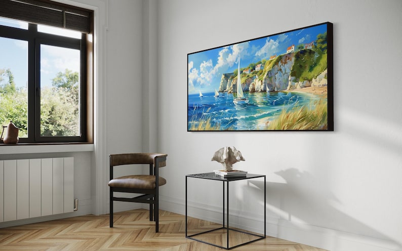 Sailboats glide on azure waters near chalky cliffs with green tops under a vast, cloud-dappled sky, portraying a serene, sunlit seascape.