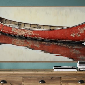 This artwork features a rustic red canoe resting serenely on calm waters. The canoe, with its weathered surface, reflects beautifully in the water, showcasing its rich color. The soft background adds a tranquil atmosphere, perfect for nature lovers.