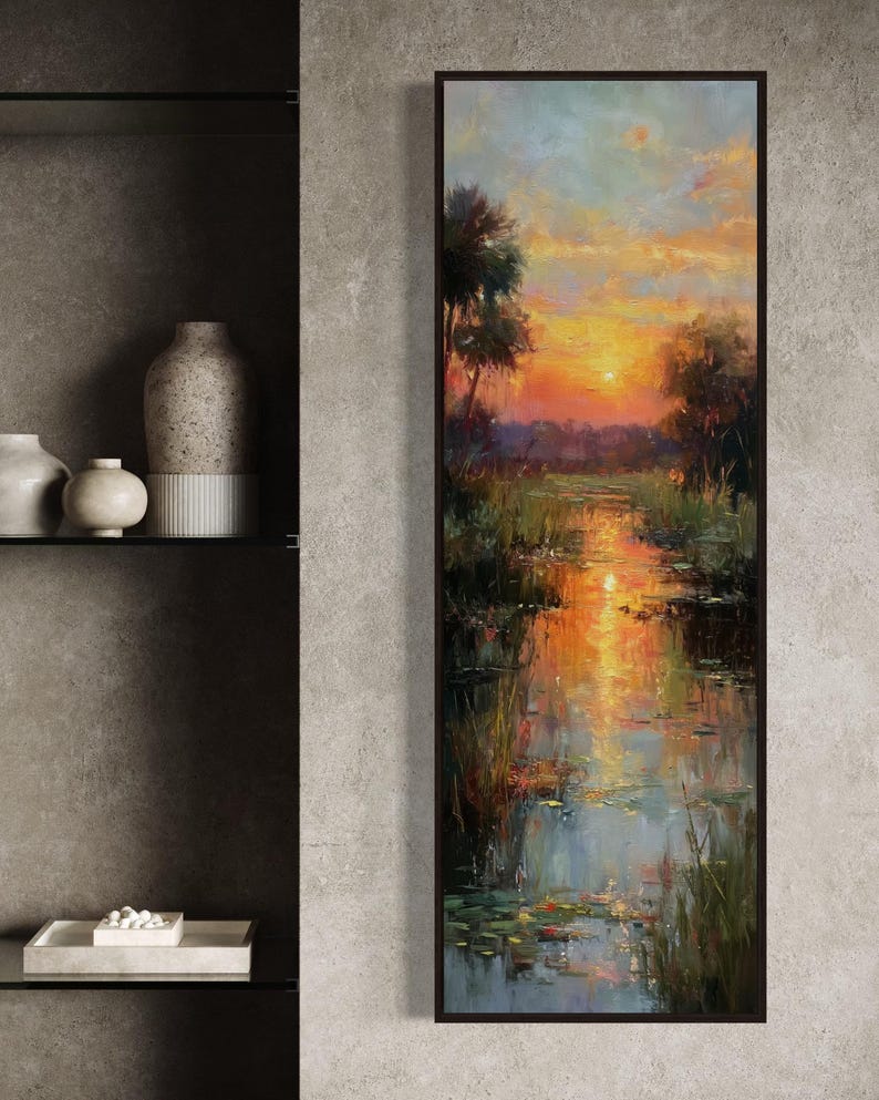 Impressionist landscape art of a glowing sunset over a peaceful waterway with lily pads and tall grasses. The golden light reflects on the calm water, surrounded by soft trees and vibrant colors. A serene nature scene perfect for rustic, cottage, or lake house decor.