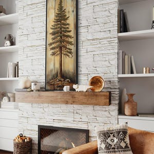 A rustic painting of a tall pine tree on wooden panels, showcasing natural textures and earthy tones. It is a perfect blend of art and nature with a handcrafted feel.