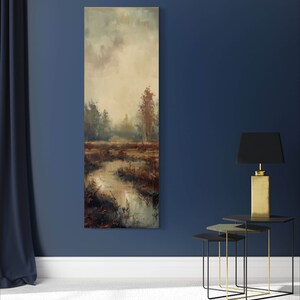This atmospheric painting captures a moody landscape with a dramatic interplay of light and shadow. A muted palette conveys the serenity of a misty marshland, evoking a sense of quiet introspection.