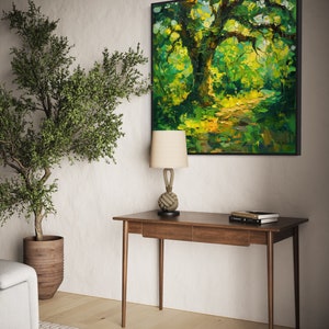 The old oak stands regal and enduring, its twisting branches like wise, outstretched arms, cloaked in a tapestry of sun-kissed leaves, creating a serene sanctuary of nature's timeless beauty.