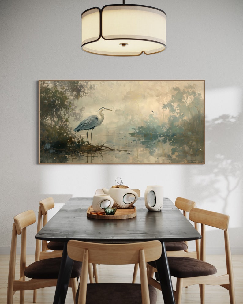 A serene heron stands amidst a tranquil swamp, reflected in the calm waters, set against a backdrop of ethereal, golden-hued trees and a soft, diffuse light that permeates this peaceful landscape painting.