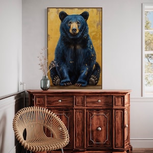Realistic painting of a blue-black bear with golden accents. The bear sits against a textured golden background, combining natural beauty with artistic flair. Perfect for adding a unique touch of wilderness charm to any space.