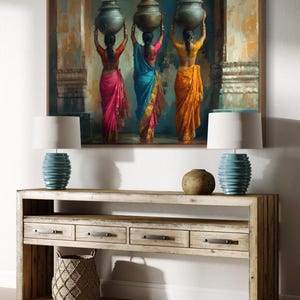 Celebrate cultural beauty with this vibrant art piece depicting three Indian women in colorful saris, gracefully carrying pots on their heads. The rich textures and warm tones make it a stunning addition to any space.