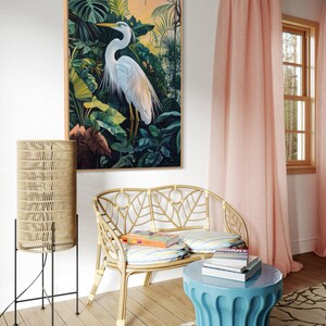 This canvas print captures a majestic heron standing amidst lush tropical foliage, illuminated by a soft, golden sunrise. Its detailed portrayal and vibrant setting make it a striking piece for any nature or bird enthusiast's collection.