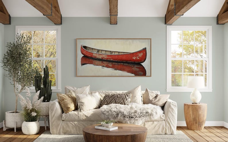 This artwork features a rustic red canoe resting serenely on calm waters. The canoe, with its weathered surface, reflects beautifully in the water, showcasing its rich color. The soft background adds a tranquil atmosphere, perfect for nature lovers.