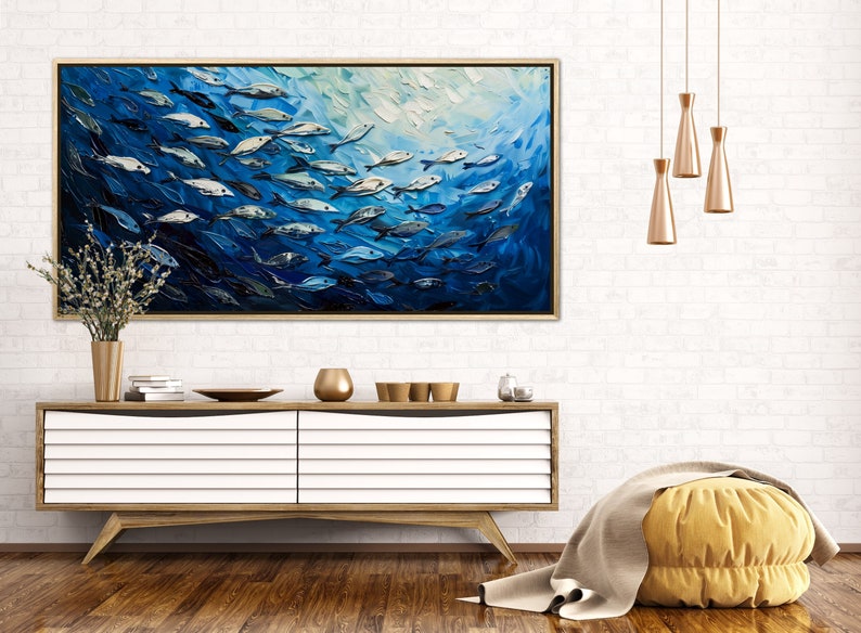 A dynamic school of fish swims in unison through the tranquil blue sea, their silvery scales reflecting light, depicted with thick, textured brushstrokes that give life and movement to this captivating marine scene.