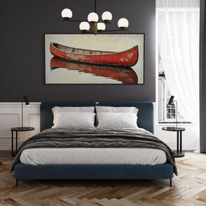 This artwork features a rustic red canoe resting serenely on calm waters. The canoe, with its weathered surface, reflects beautifully in the water, showcasing its rich color. The soft background adds a tranquil atmosphere, perfect for nature lovers.