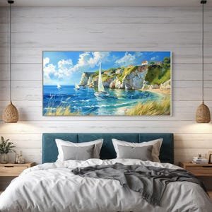 Sailboats glide on azure waters near chalky cliffs with green tops under a vast, cloud-dappled sky, portraying a serene, sunlit seascape.
