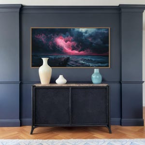 This dramatic storm canvas captures a dark ocean scene with a striking pink lightning sky over a wooden pier. The moody waves and vibrant storm clouds create a bold statement piece. Perfect for lovers of dramatic nature art, coastal décor.