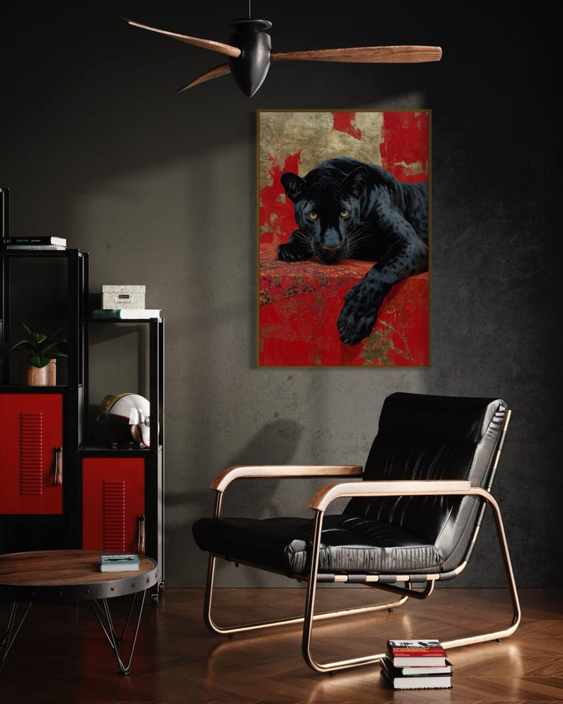 Striking art print of a black panther resting against a rich red and gold abstract background. The panther’s piercing gaze, sleek dark fur, and powerful presence create a dramatic and luxurious statement piece, blending wildlife majesty with bold modern art design for a captivating interior accent.