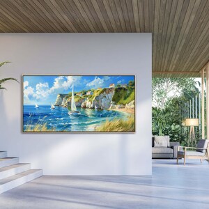 Sailboats glide on azure waters near chalky cliffs with green tops under a vast, cloud-dappled sky, portraying a serene, sunlit seascape.