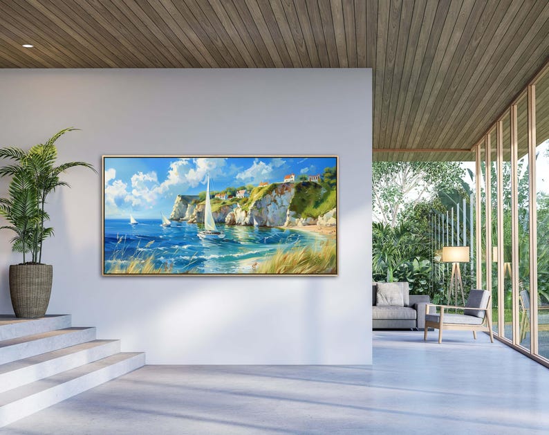 Sailboats glide on azure waters near chalky cliffs with green tops under a vast, cloud-dappled sky, portraying a serene, sunlit seascape.