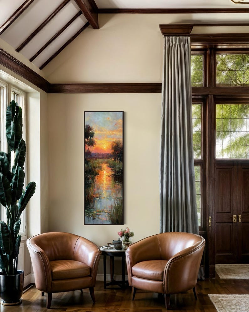 Impressionist landscape art of a glowing sunset over a peaceful waterway with lily pads and tall grasses. The golden light reflects on the calm water, surrounded by soft trees and vibrant colors. A serene nature scene perfect for rustic, cottage, or lake house decor.