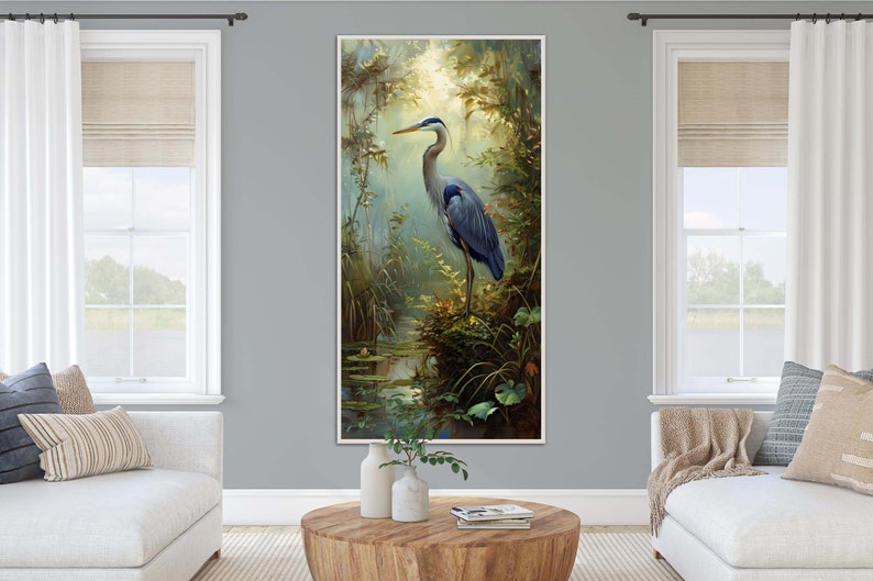 A serene Blue Heron stands amidst a lush wetland oasis, its graceful form bathed in dappled sunlight filtering through a verdant canopy. Perfect for a tranquil decor piece.