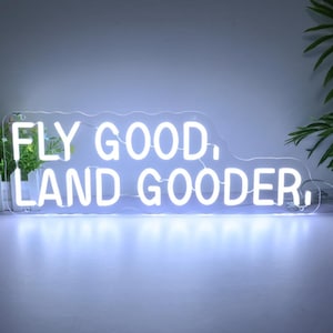 Neon Fly Good Land Gooder: Dekoracja z humorem lotniczym