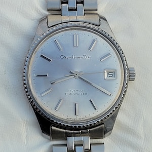 Reloj Citizen Homer Date vintage: bisel estriado, acero inoxidable, 17 joyas