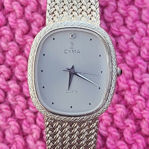 Cyma Le Locle Quartz Watch: Diamond Silver Braided Bracelet